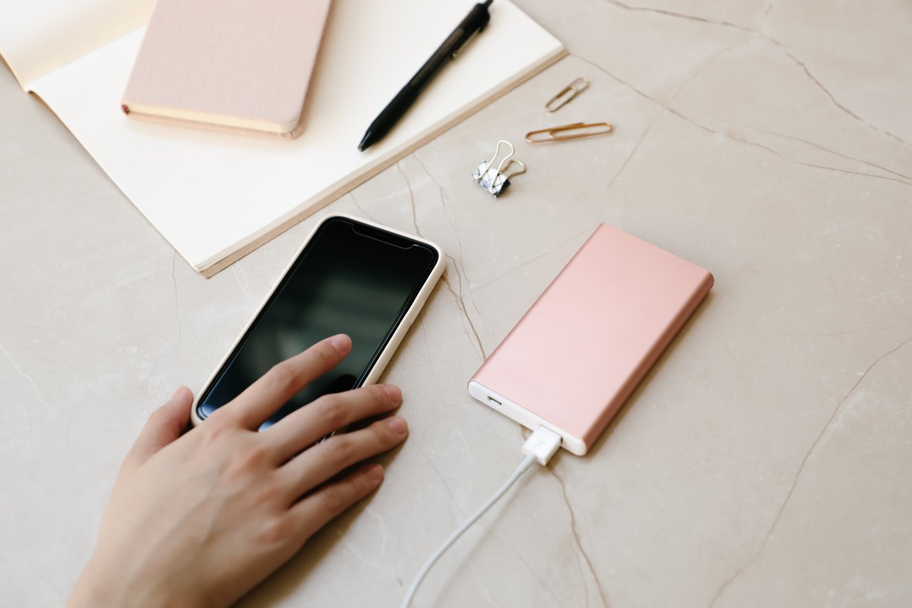 Rose Gold Power Bank and Mobile Phone 
Charging Lifestyle Shot